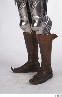 Photos Medieval Knight in plate armor 1 legs medieval clothing…